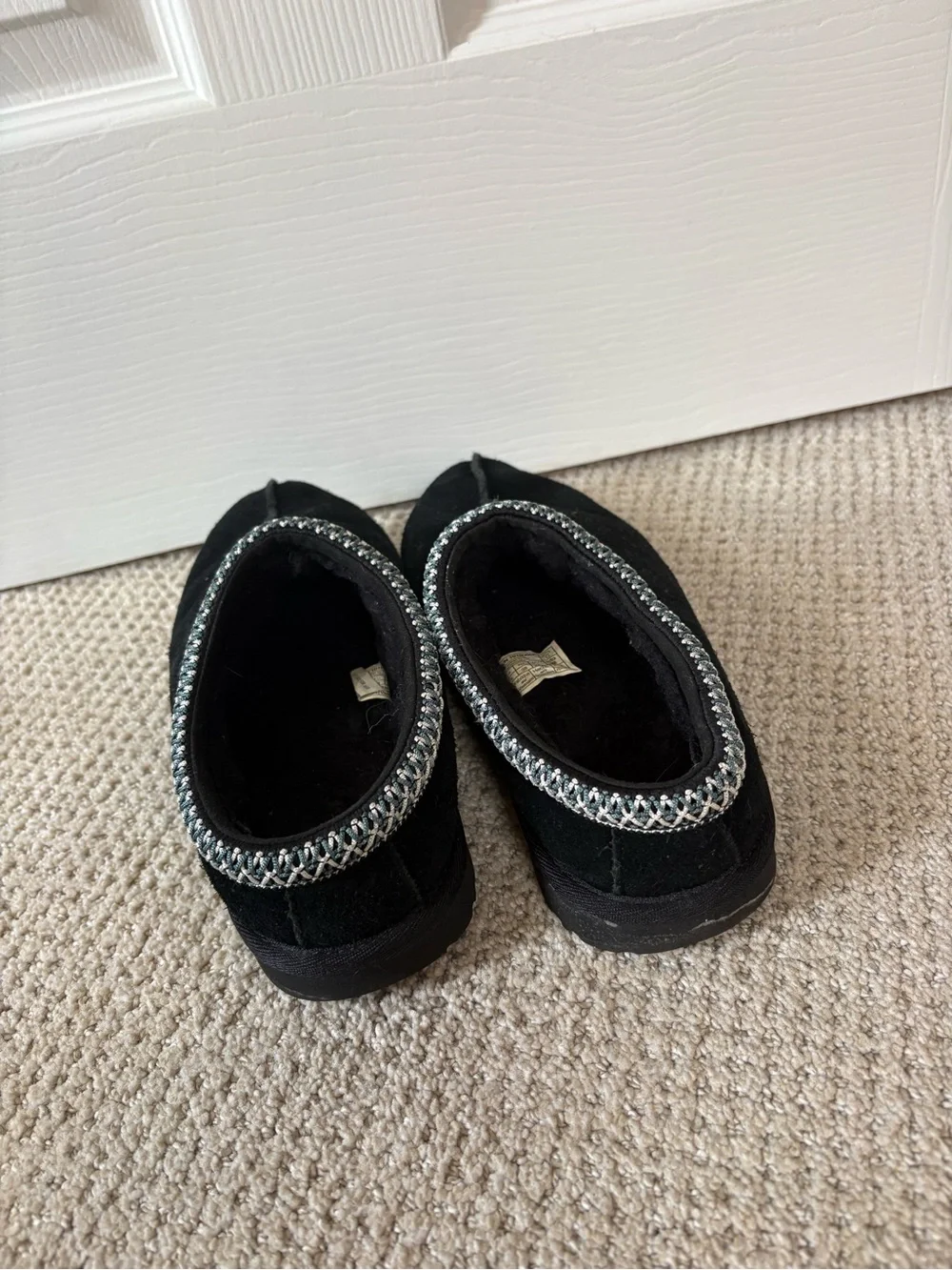 UGG Kids Black Slip-On Moccasin Slippers with Silver Trim